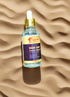 Kojic Acid Face Serum bottle on a sandy background for brightening and hydrating skincare.