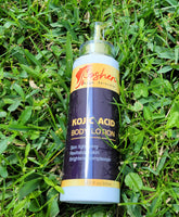 Kojic Acid Body Lotion bottle on grass, perfect for brightening and hydrating skin